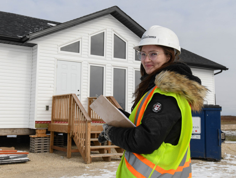 Kayla Heppner gets ready to do quality control inspections in our RTM homes.