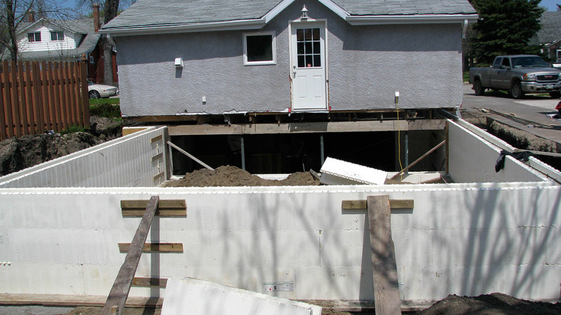 Portage la Prairie shored up house and put a new foundation under it.