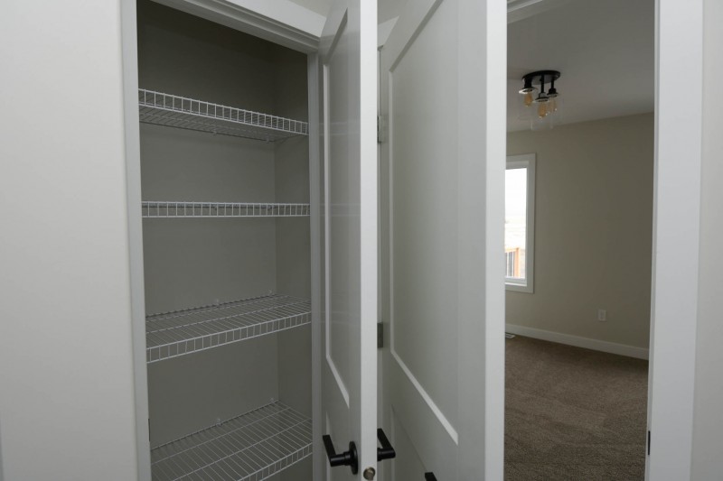 Ensuite linen closet.