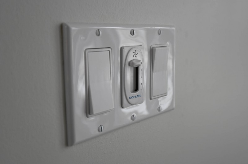 Bank of switches with ceiling fan controls.